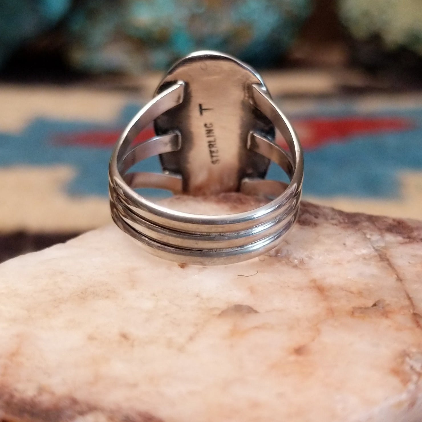 Sterling silver ring with Redskin turquoise set in oval bezel.