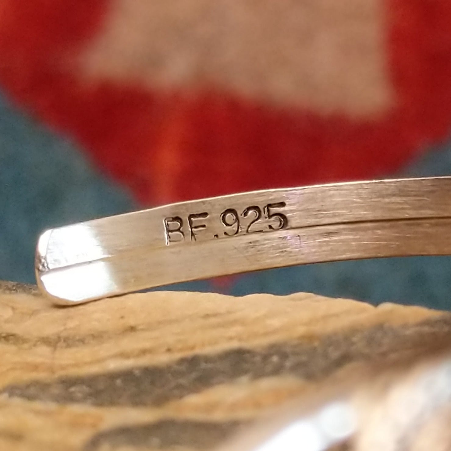 Close-up of the artisan's stamped signature.