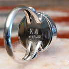 Close-up of the artisan's stamped initials.
