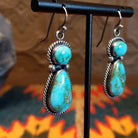 Earrings with Sonoran Gold turquoise set in bezels framed by twisted rope and dotted accents.