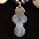 Close-up of the artisan's stamped signature.