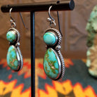 Earrings with Sonoran Gold turquoise set in bezels framed by twisted rope and dotted accents.