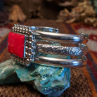 Rosarita set in the square bezel, framed by intricate dotted accents and a layered sterling silver band that forms the cuff.