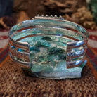 Rosarita set in the square bezel, framed by intricate dotted accents and a layered sterling silver band that forms the cuff.