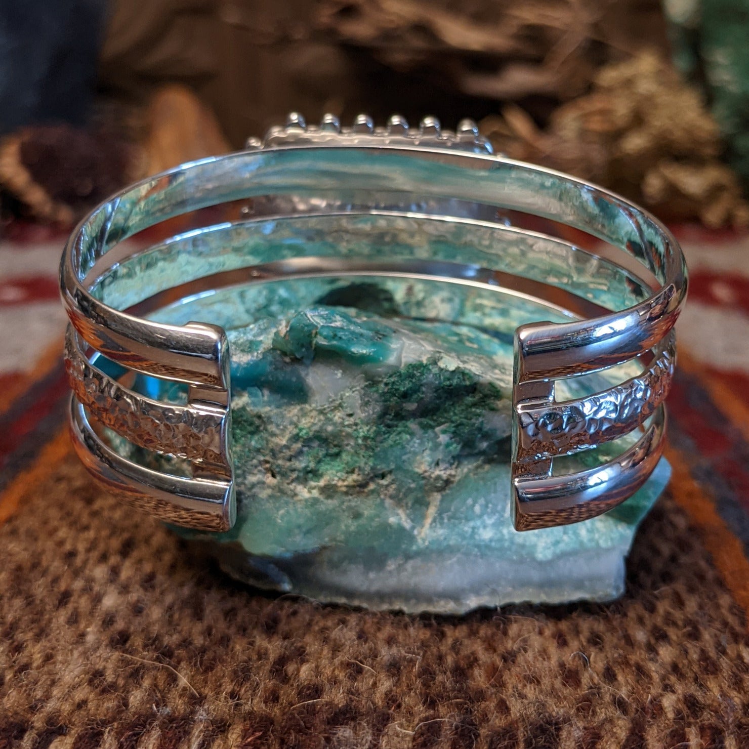 Rosarita set in the square bezel, framed by intricate dotted accents and a layered sterling silver band that forms the cuff.