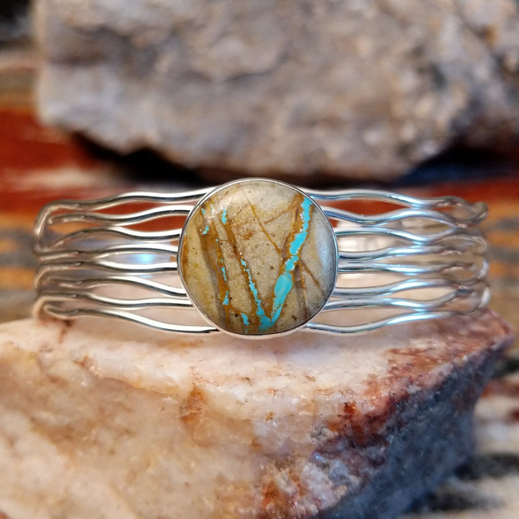 Sterling silver layered wire cuff with round boulder turquoise set in the bezel.