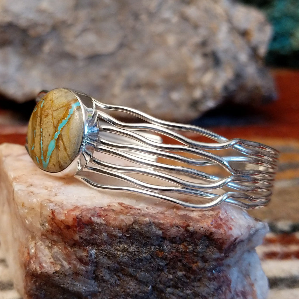 Sterling silver layered wire cuff with round boulder turquoise set in the bezel.