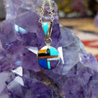 14kt gold round multistone inlay pendant by Selena Warner with geometric mosaic design and tapered gold bail.