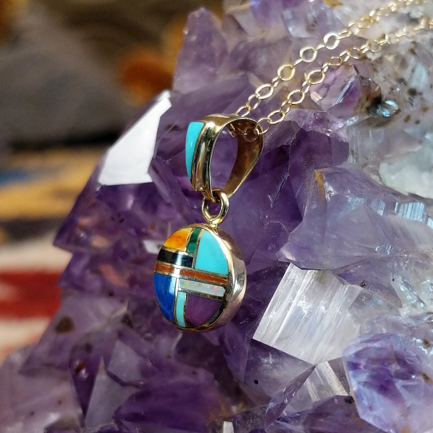 14kt gold round multistone inlay pendant by Selena Warner with geometric mosaic design and tapered gold bail.