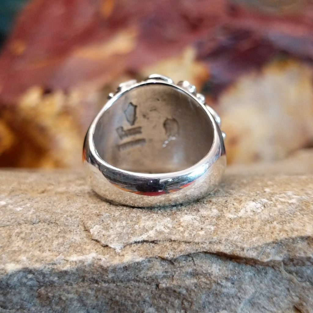 The tapered polished sterling silver band.