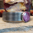 A round purple spiny oyster shell cuff in sterling silver with layered bands.