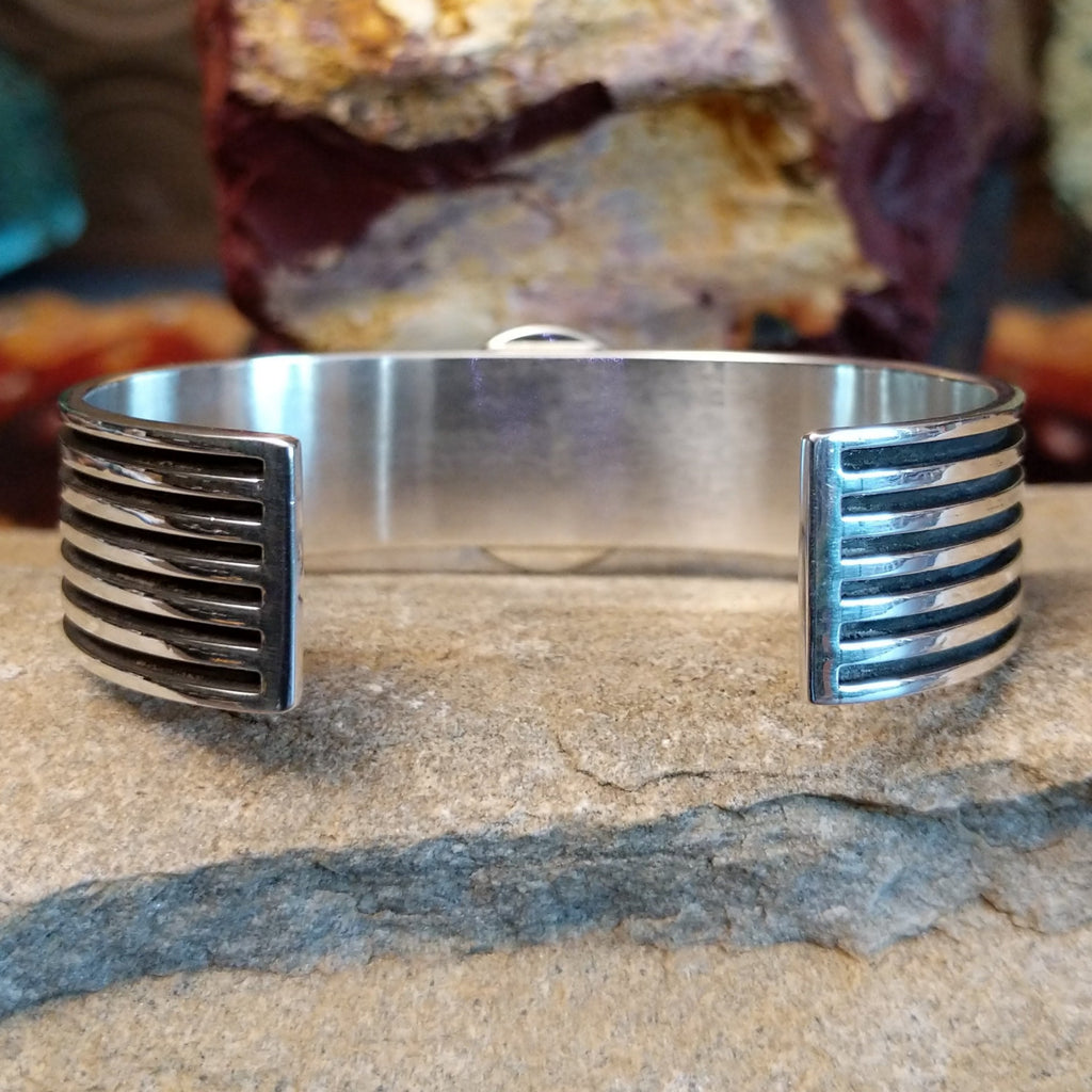 The polished sterling silver and layered bands.