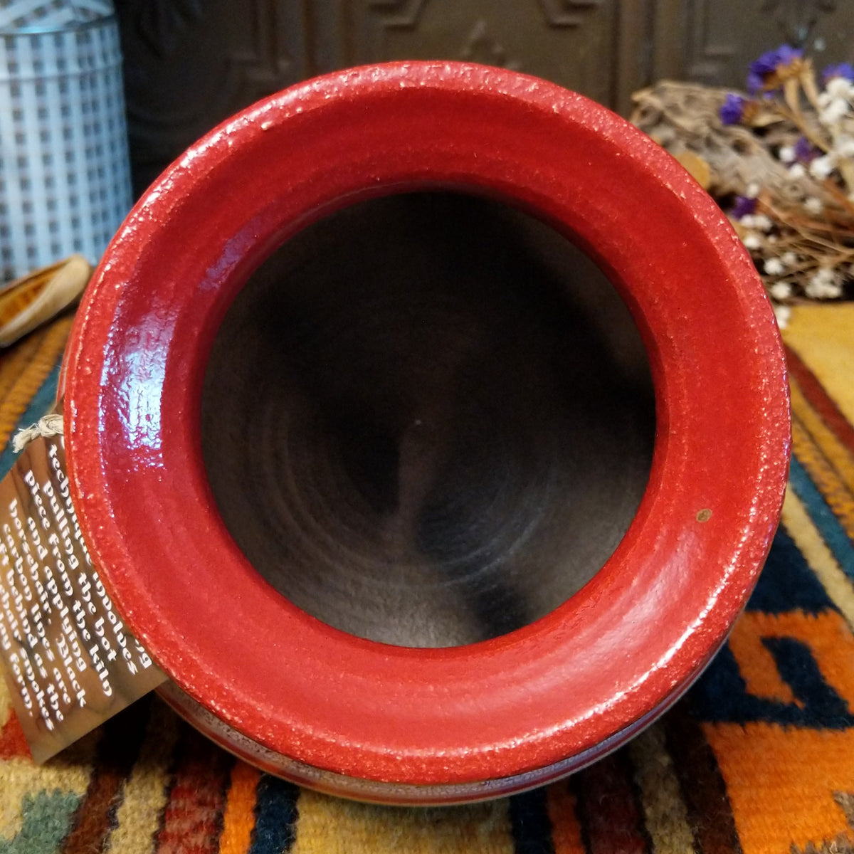 Round horsehair pottery vase by Roger Calhoun with a wide red rim, gold and lavender crackled shoulder, red accent band, and smoky black horsehair markings across a cream-colored body.