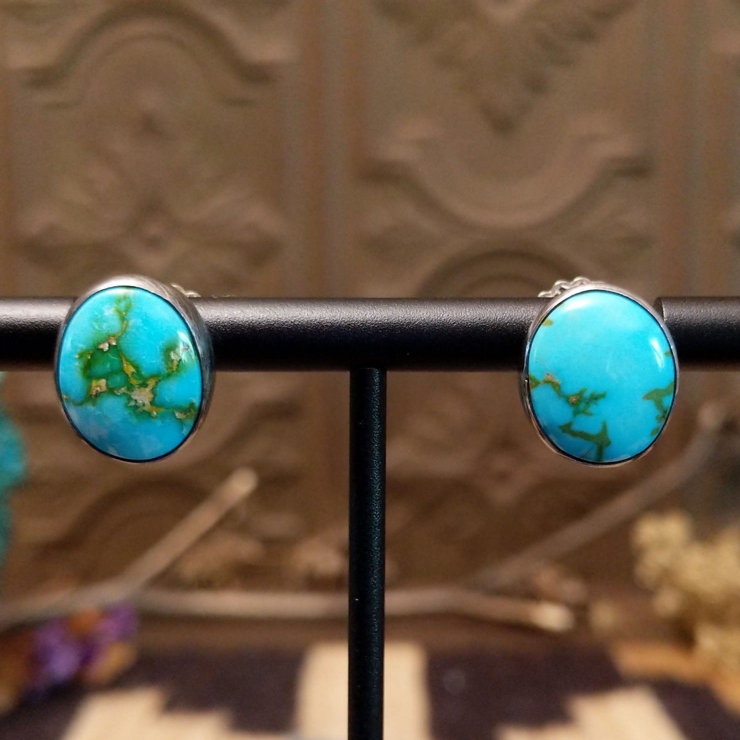 Sterling silver post earrings with Sonoran gold turquoise set in round bezels.
