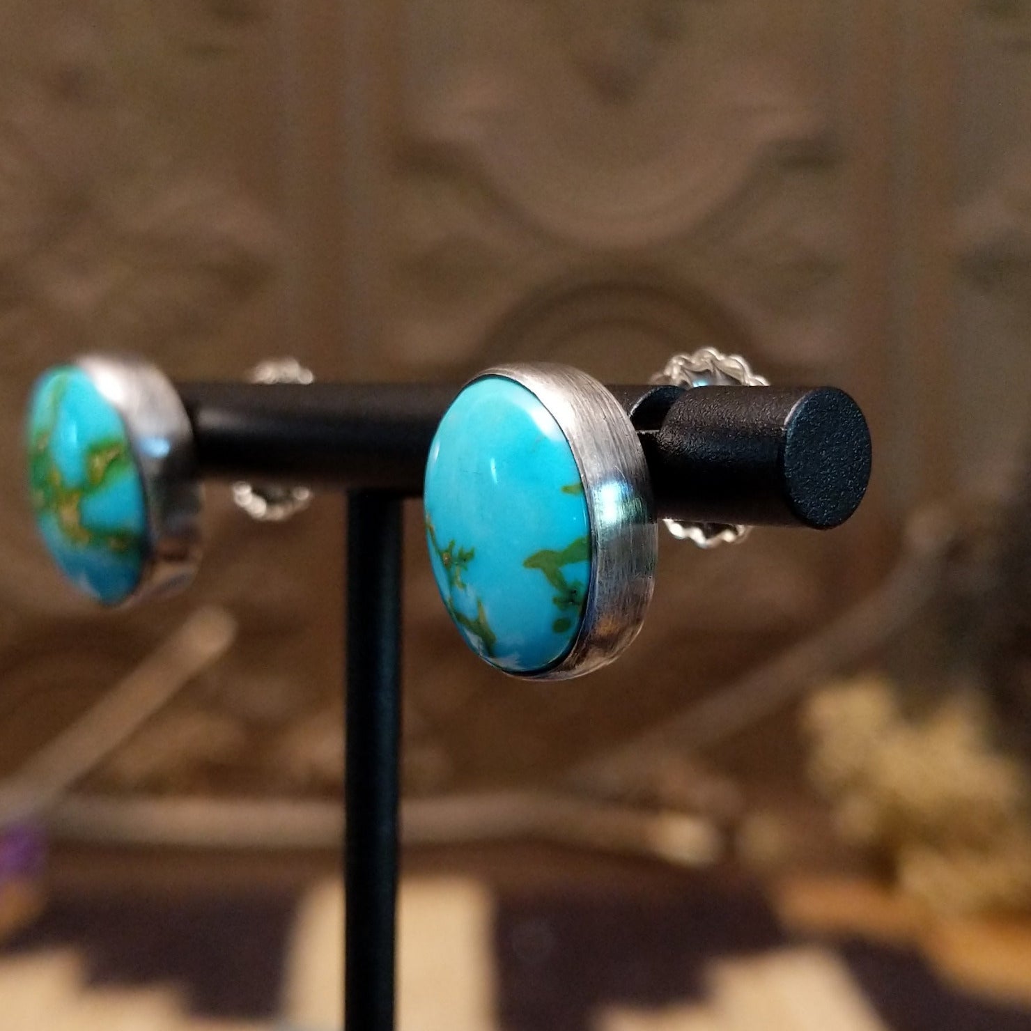 Sterling silver post earrings with Sonoran gold turquoise set in round bezels.