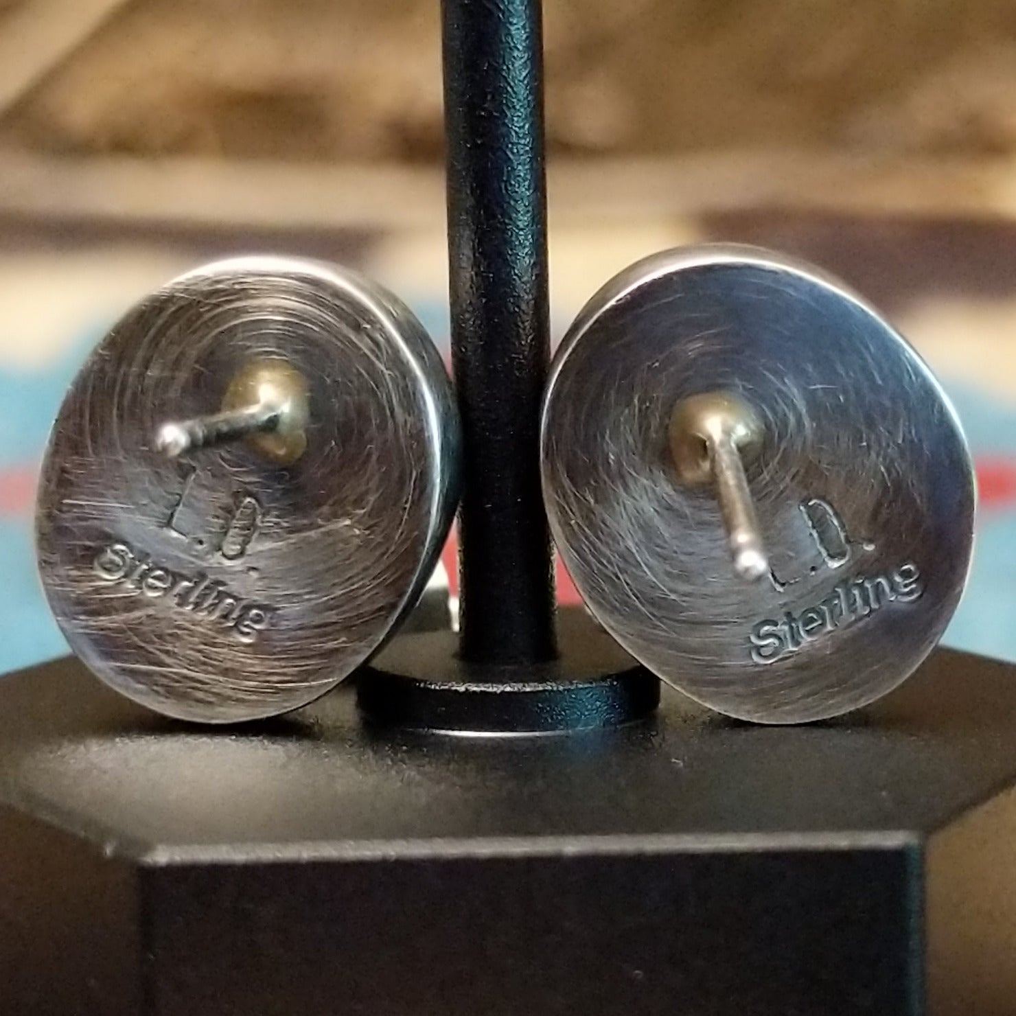 Close-up of the artisan's stamped signature.