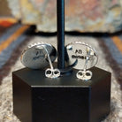 The backings feature the artist's signature and stamp.