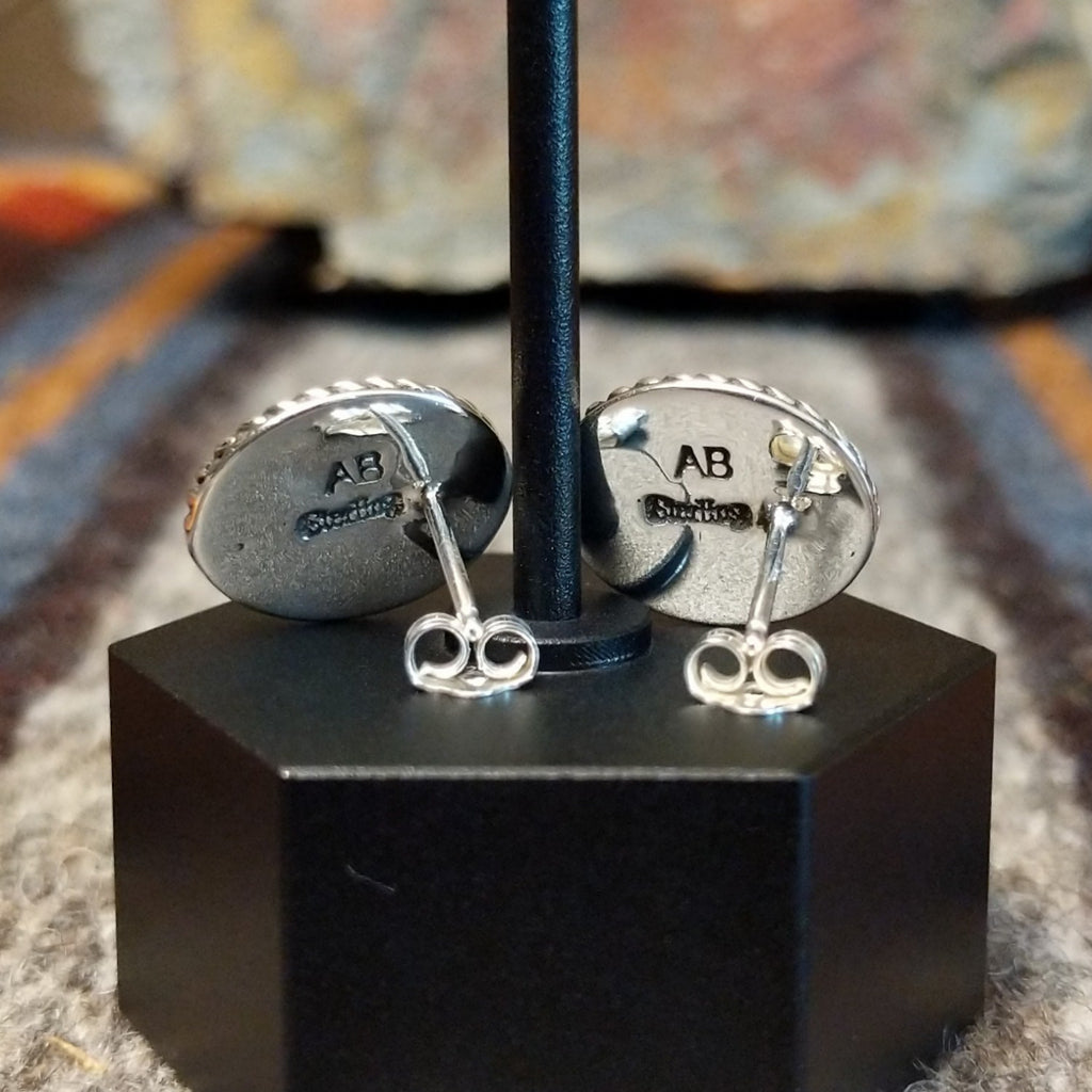 The backings feature the artist's signature and stamp.