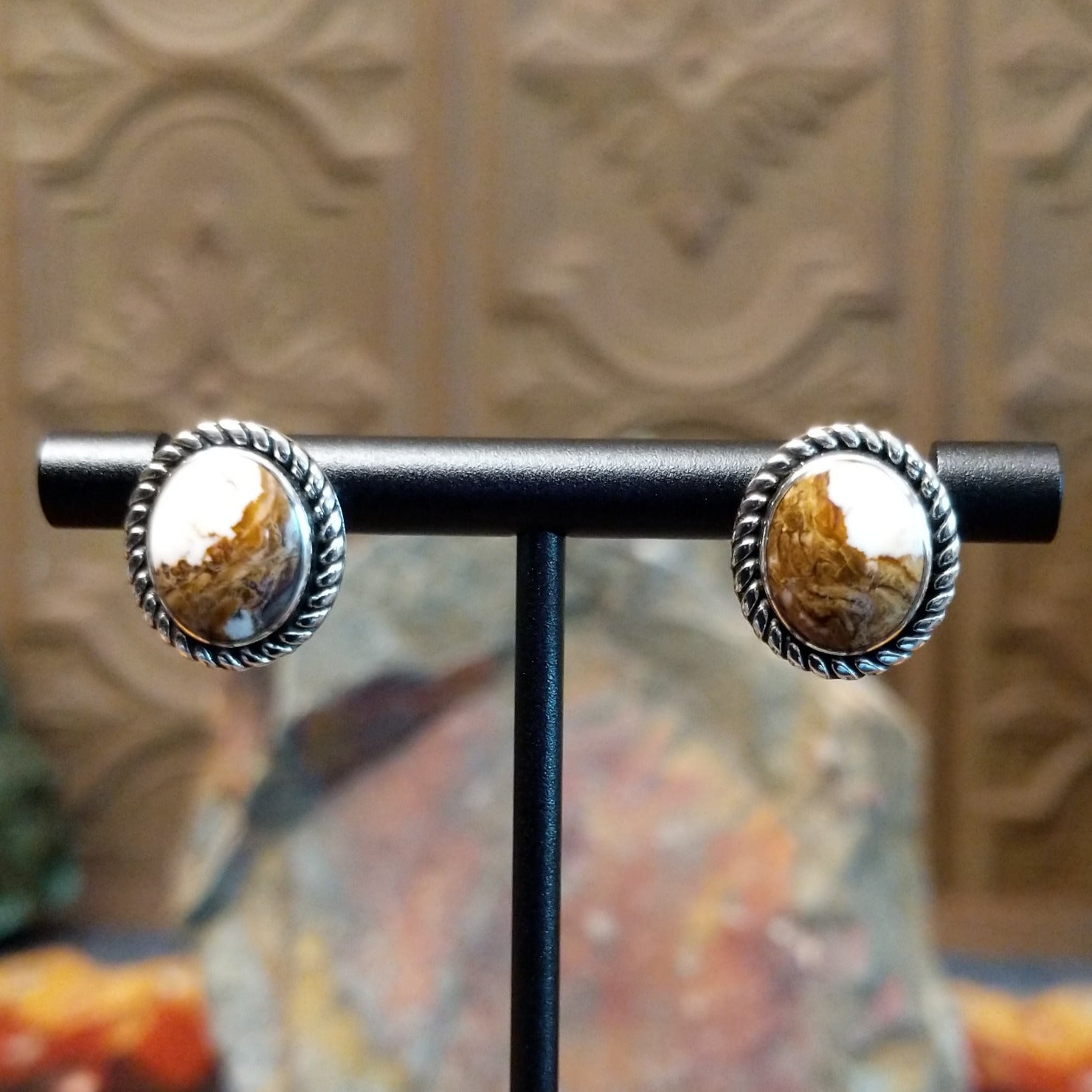 Wild horse stones set in twisted rope bezels. 