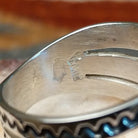 Close-up of the artisan's signature.