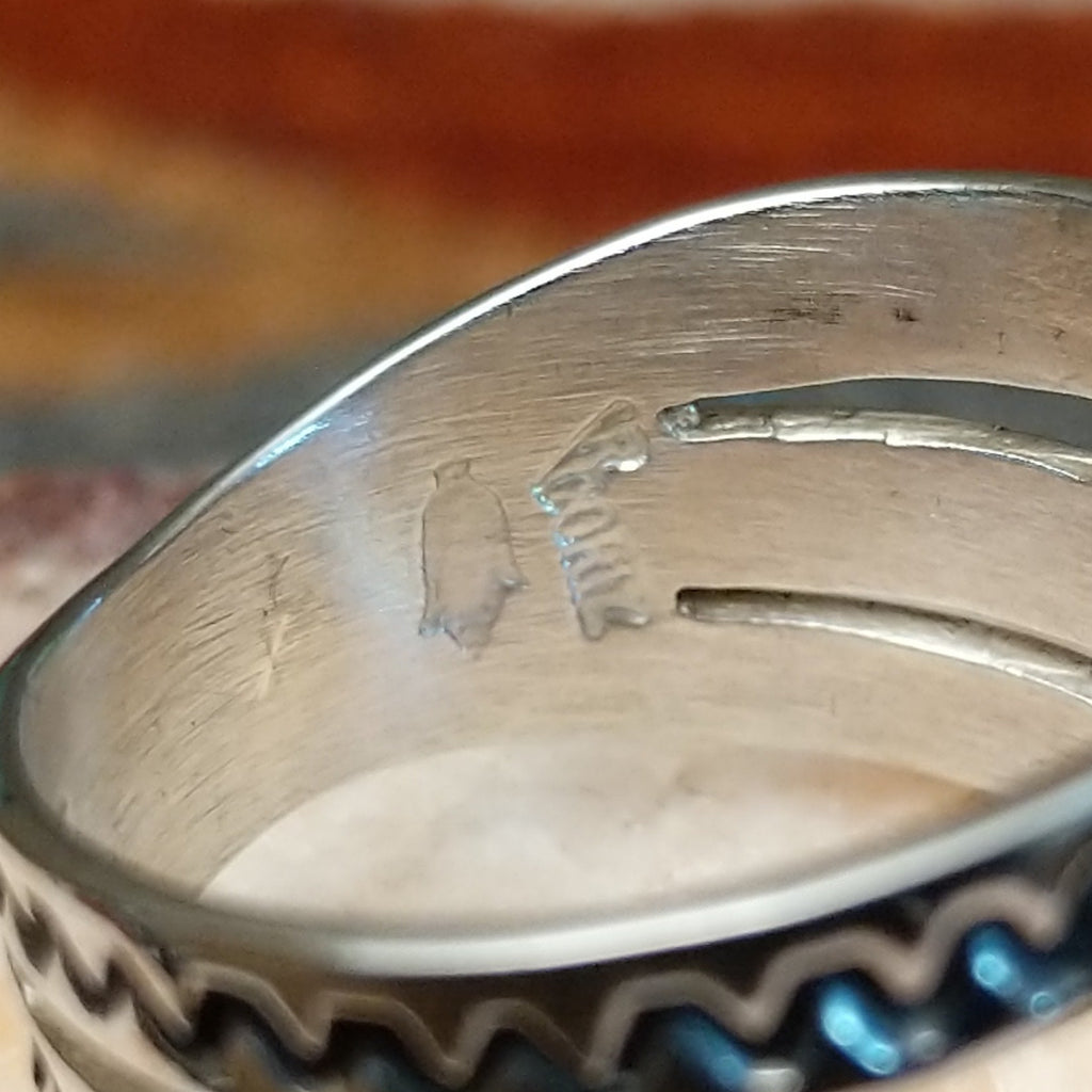 Close-up of the artisan's signature.