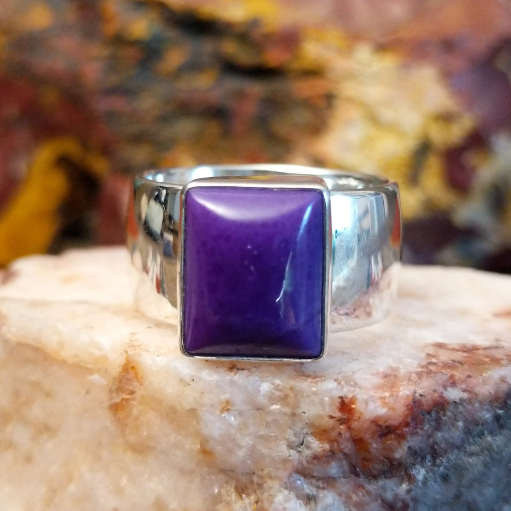 Sterling silver ring with square sugilite set in a raised bezel.