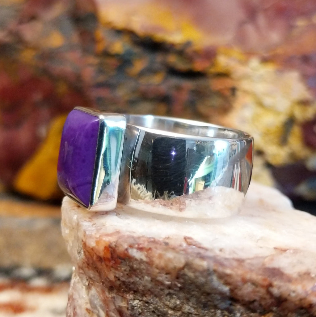Sterling silver ring with square sugilite set in a raised bezel.