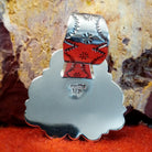 The back features the artisan's initials stamped.