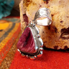 Triangular purple spiny oyster shell set in sterling silver with twisted rope accents, scalloped edges, and detailed dot work.