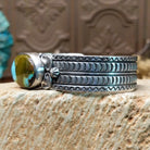 Sterling silver cuff with Royston turquoise set in the oval bezel and geometric stamping on the band.