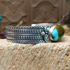 Sterling silver cuff with Royston turquoise set in the oval bezel and geometric stamping on the band.