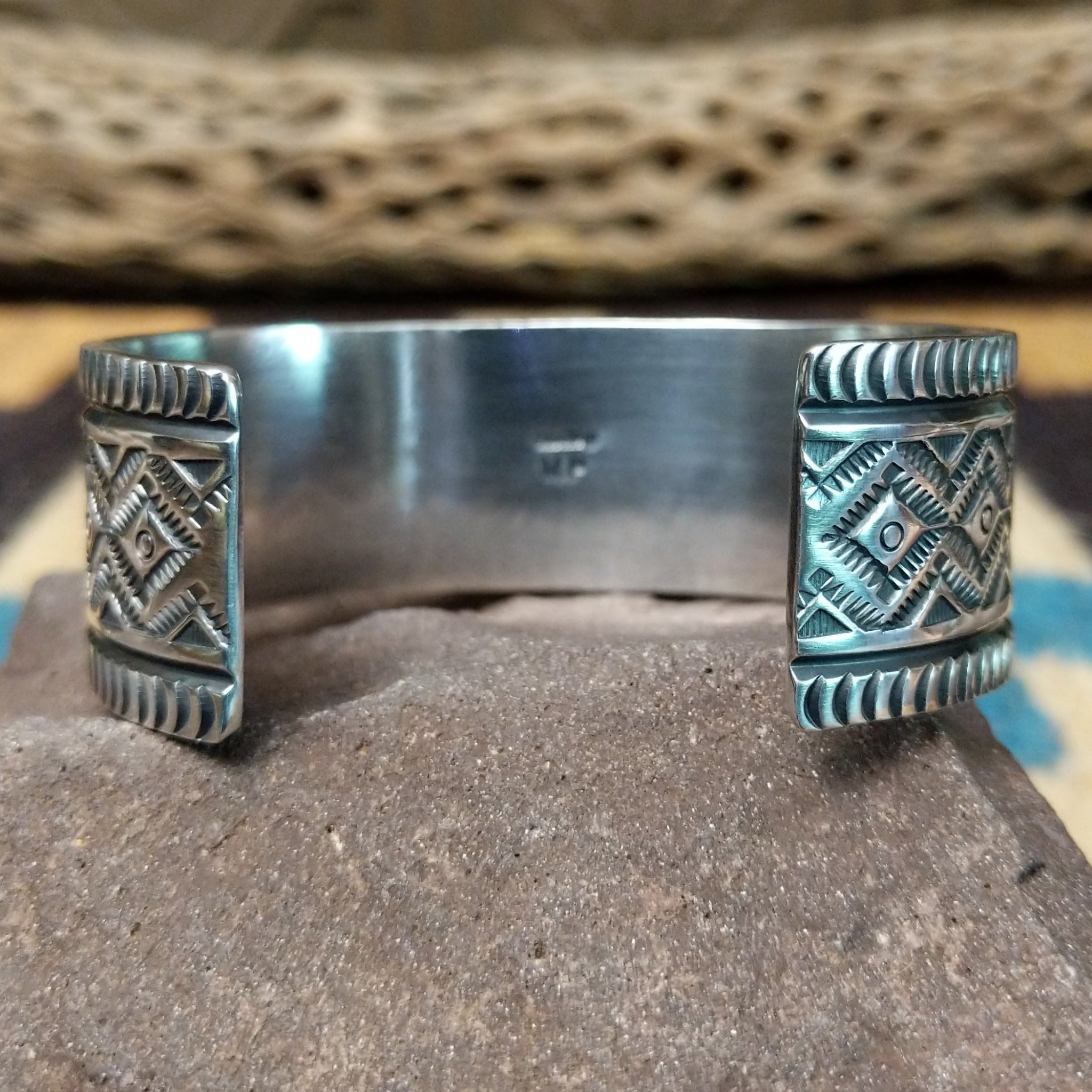 Royston turquoise cuff by Murphy Platero, featuring a vibrant blue and green Royston turquoise stone with natural matrix set in a handcrafted sterling silver open cuff.  Underside view.