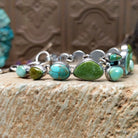 Sterling silver bracelet with Royston turquoise set in various shaped geometric bezels.