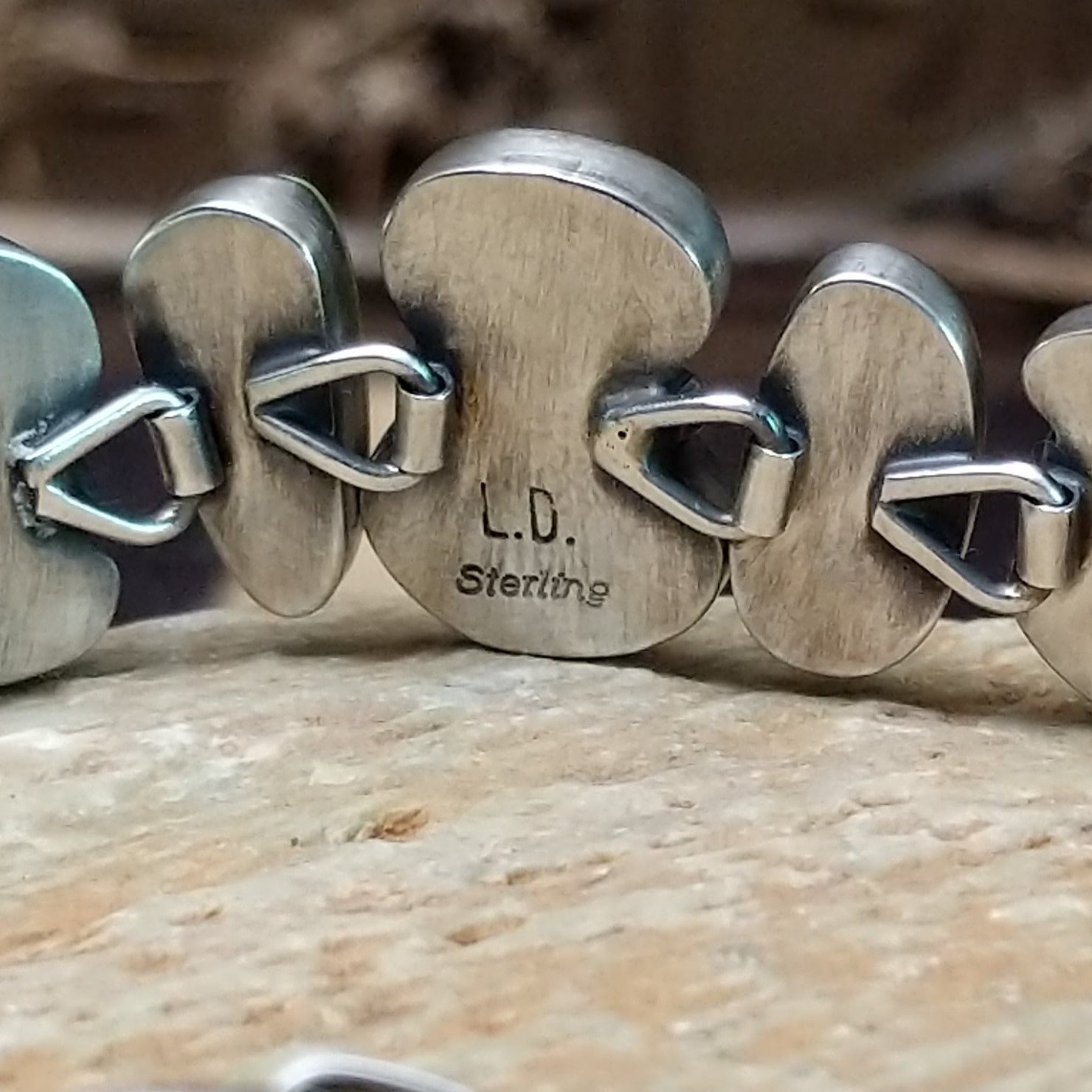 Close-up of the artisan's stamped signature.