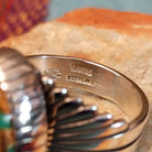 Close up of the artist's stamped signature