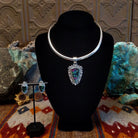 Ruby zoisite set in sterling silver bezels framed by dotted accents on both the earrings and pendant.