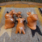 Clay sculpted into individual pieces of a nativity scene and glazed.