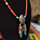 Red-orange bead necklace with a round multistone mosaic centerpiece and two matching dangling mosaic pendants