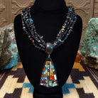 Sterling silver necklace featuring beaded strands and multistone inlay on the pendant.
