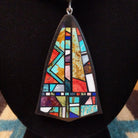 Sterling silver necklace featuring beaded strands and multistone inlay on the pendant.