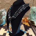 Sterling silver necklace featuring beaded strands and multistone inlay on the pendant.