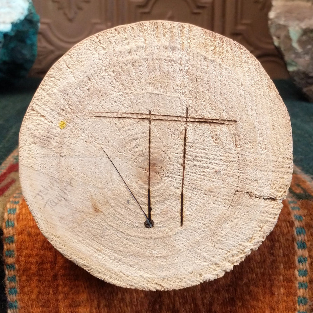 The artisan's signature is found on the base.