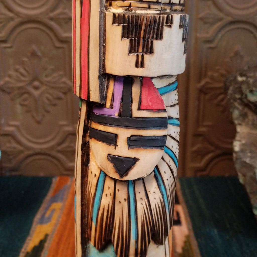 Close-up of the various motifs on the body of the totem.