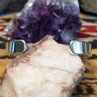 Interior view of handcrafted cuff showing band thickness and fit.