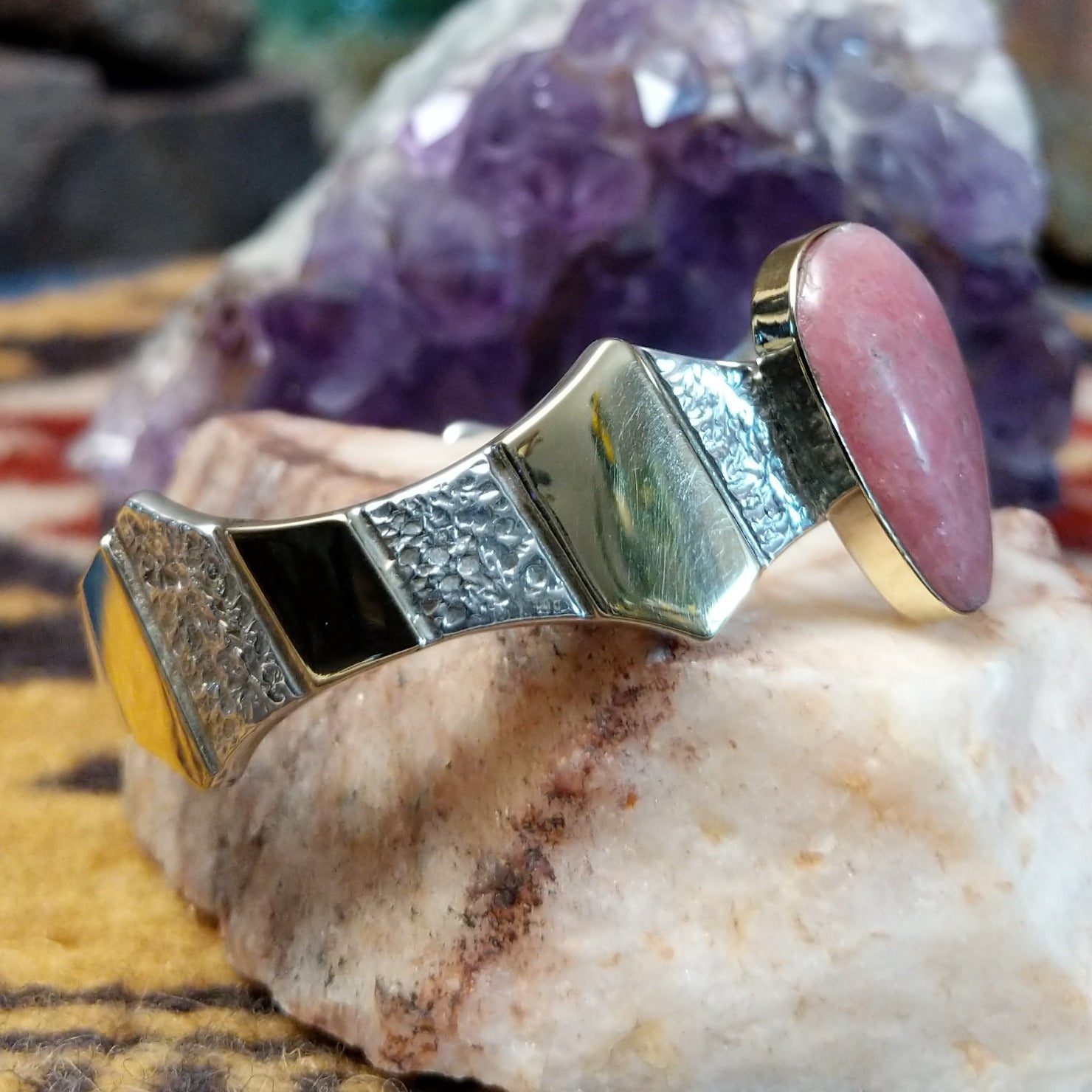Sterling silver and 14k gold cuff by Marc Antia with pear-shaped rhodochrosite stone.