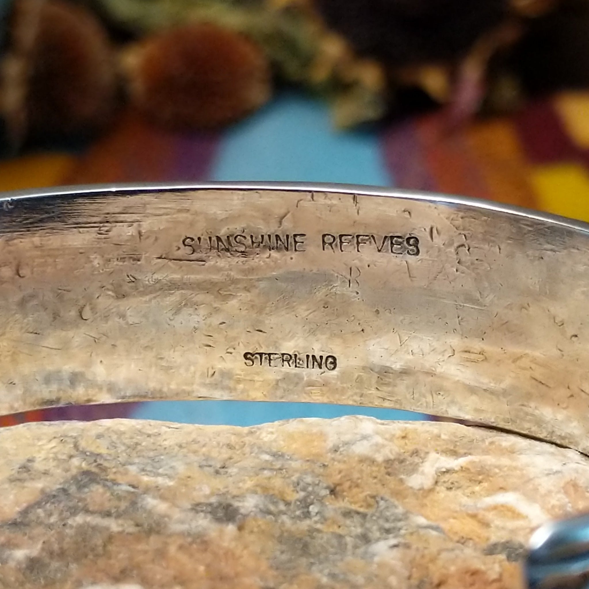 Close up of the artist's stamped signature
