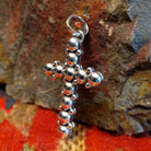 Sterling silver beaded cross pendant by Navajo artisan Artie Yellowhorse.