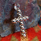 Sterling silver beaded cross pendant by Navajo artisan Artie Yellowhorse.