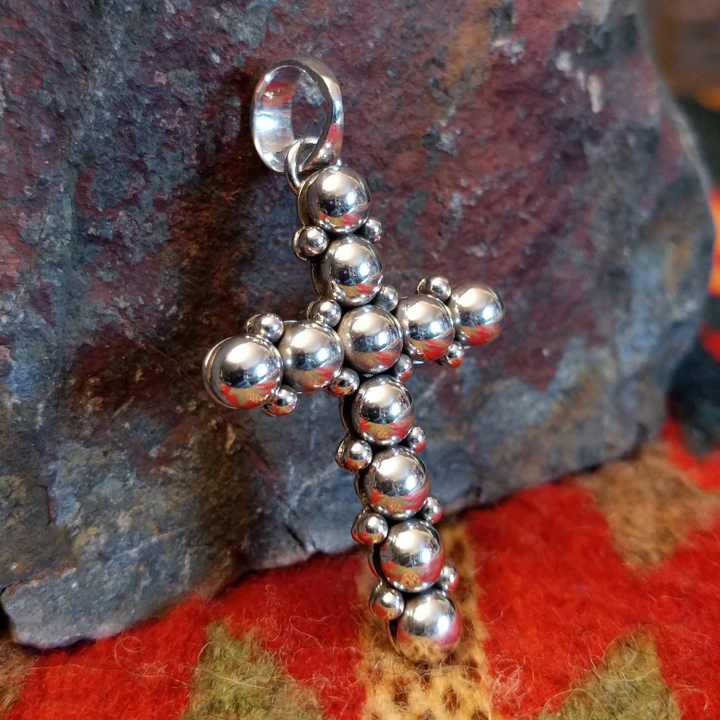 Sterling silver beaded cross pendant by Navajo artisan Artie Yellowhorse.