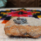 Silver coil hoop earrings by Katrina Tsosie.